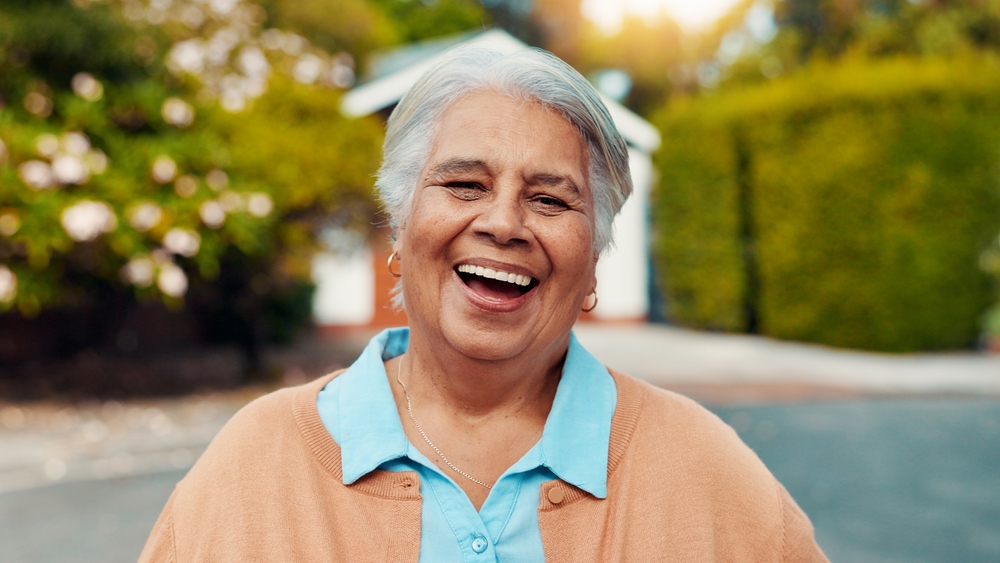 patient's happy and confident smile after Dentures